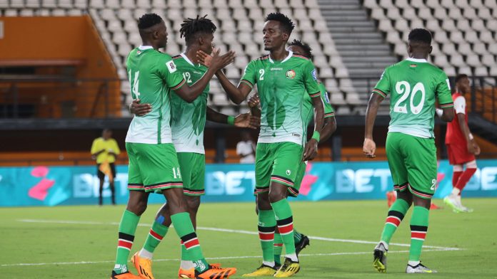 Harambee stars players high-fiving one another.