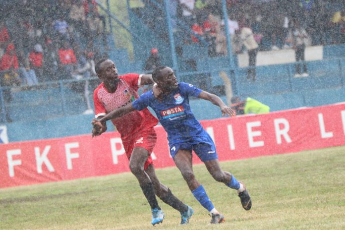 Shabana player vs Posta Rangers player contesting for the ball.