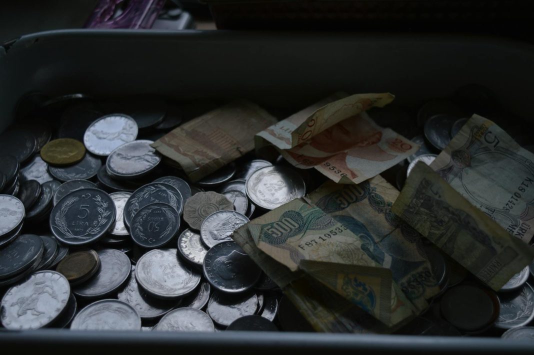 A tray full of coins and money in africa betting